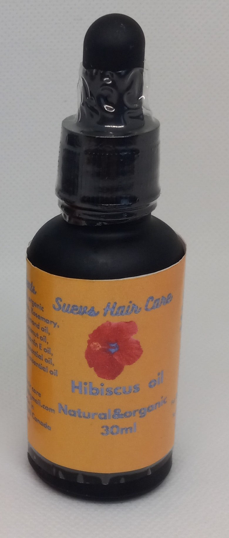 30ml cold-infused Hibiscus hair oil enriched with hibiscus petals and essential oils to support healthy, moisturized hair.