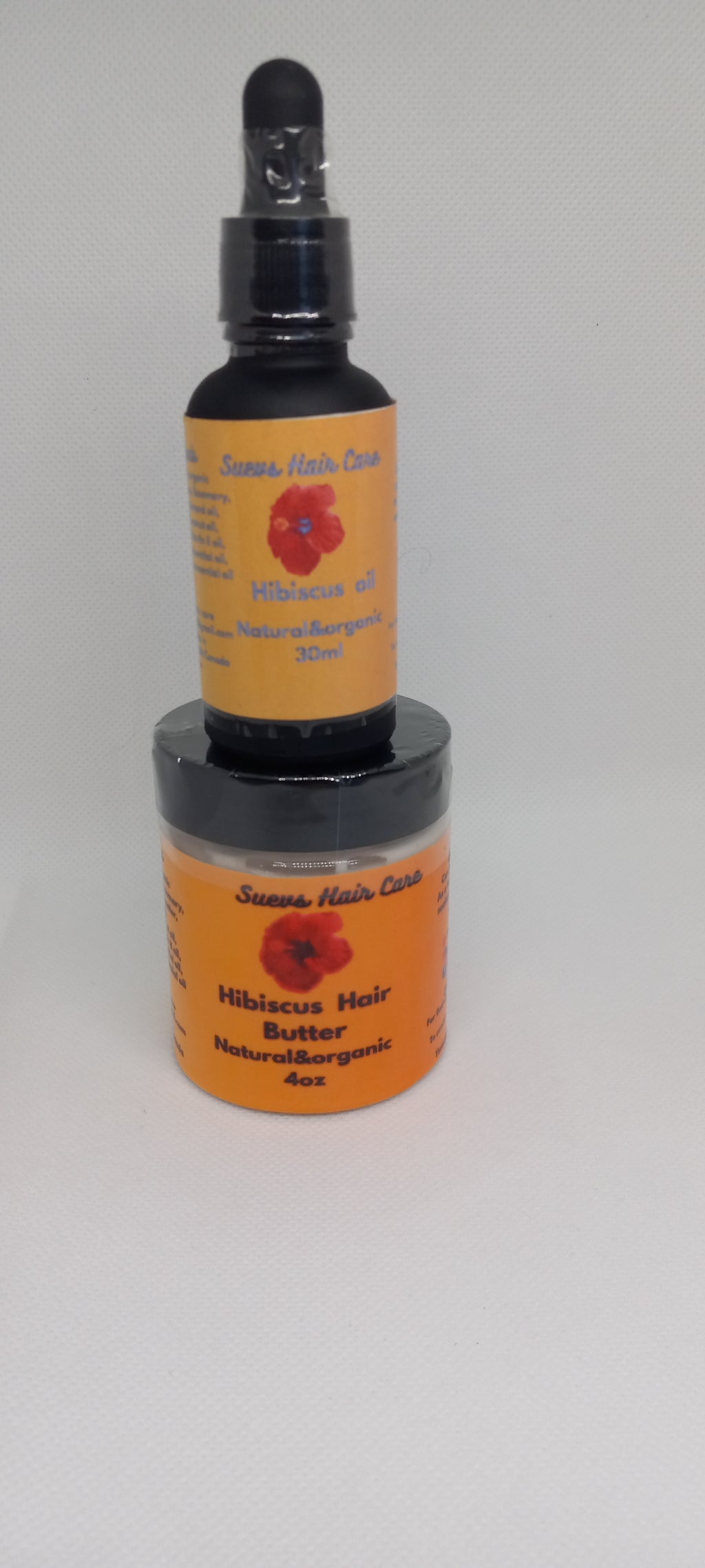 30ml Hibiscus oil and 4oz Hibiscus butter made with shea butter, mango butter, Hibiscus petals, and essential oils for scalp care and moisture retension.