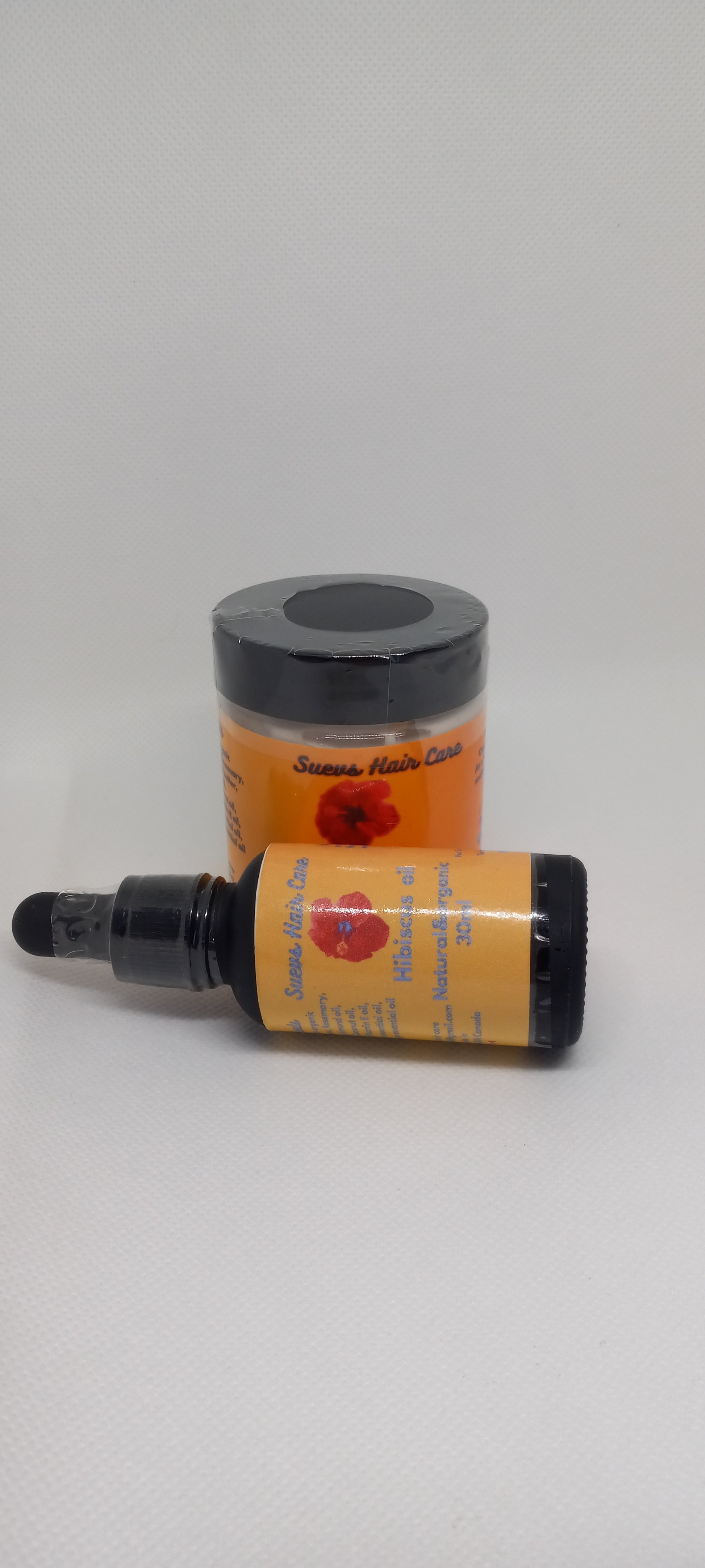Hibiscus-infuse Hair oil and whipped hibiscus butter set, 30ml and 4oz sizes, for soft, strong, and hydrated natural hair.